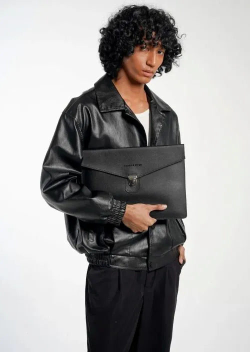 A man holding an envelope bag