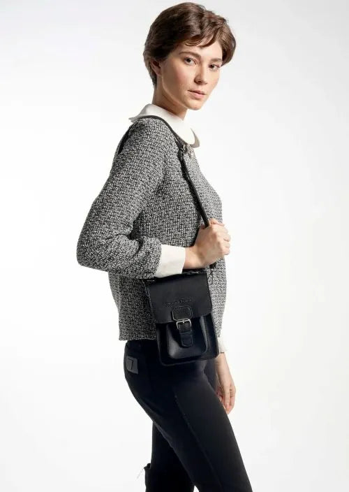 A woman with a mini sling bag
