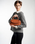 Geneva Elongated Top Handle Bag Tan