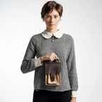 A lady wearing a mini sling bag 
#color_affogato