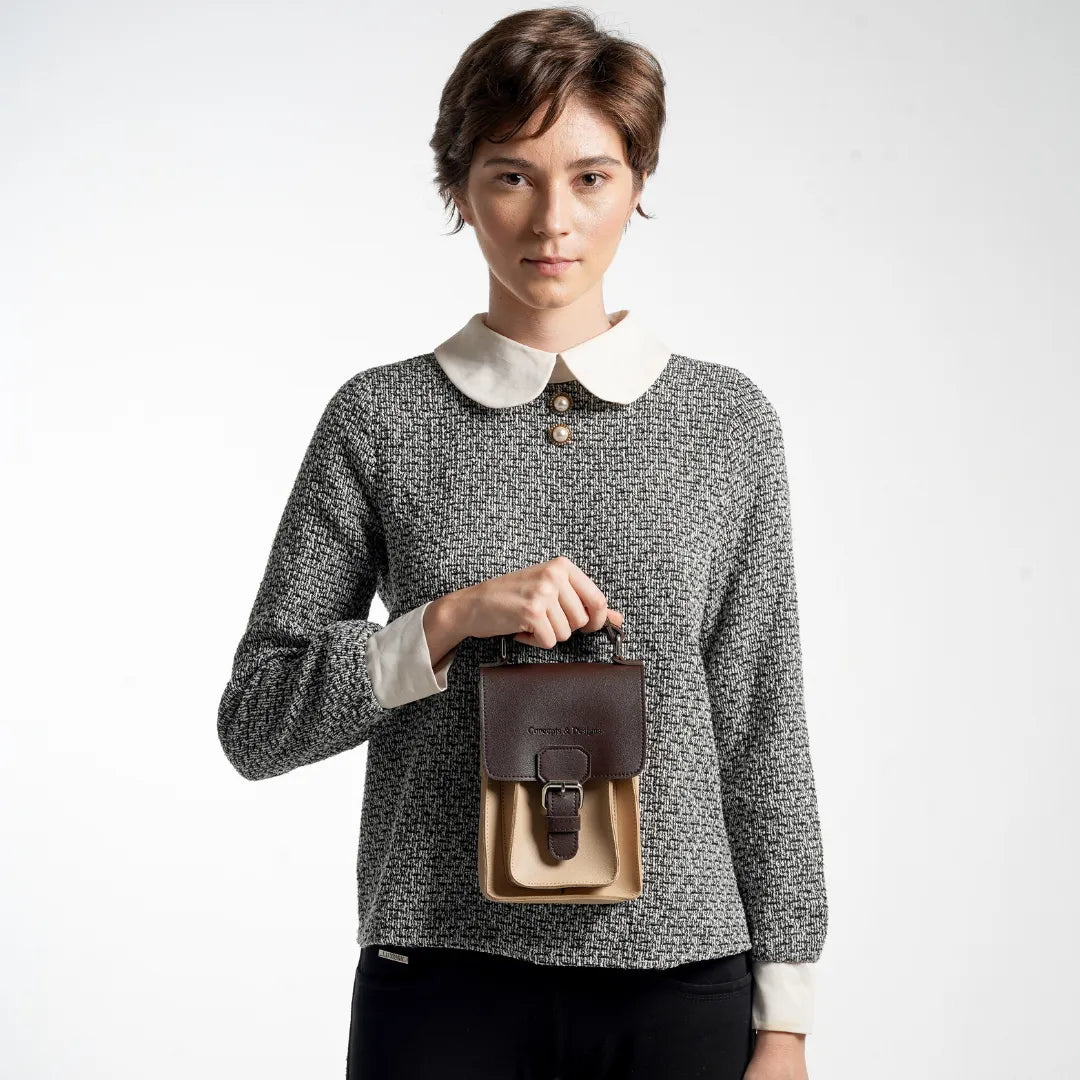 A lady wearing a mini sling bag 
#color_affogato