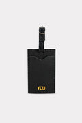 Black luggage tag with 'YOU' engraved on a white background