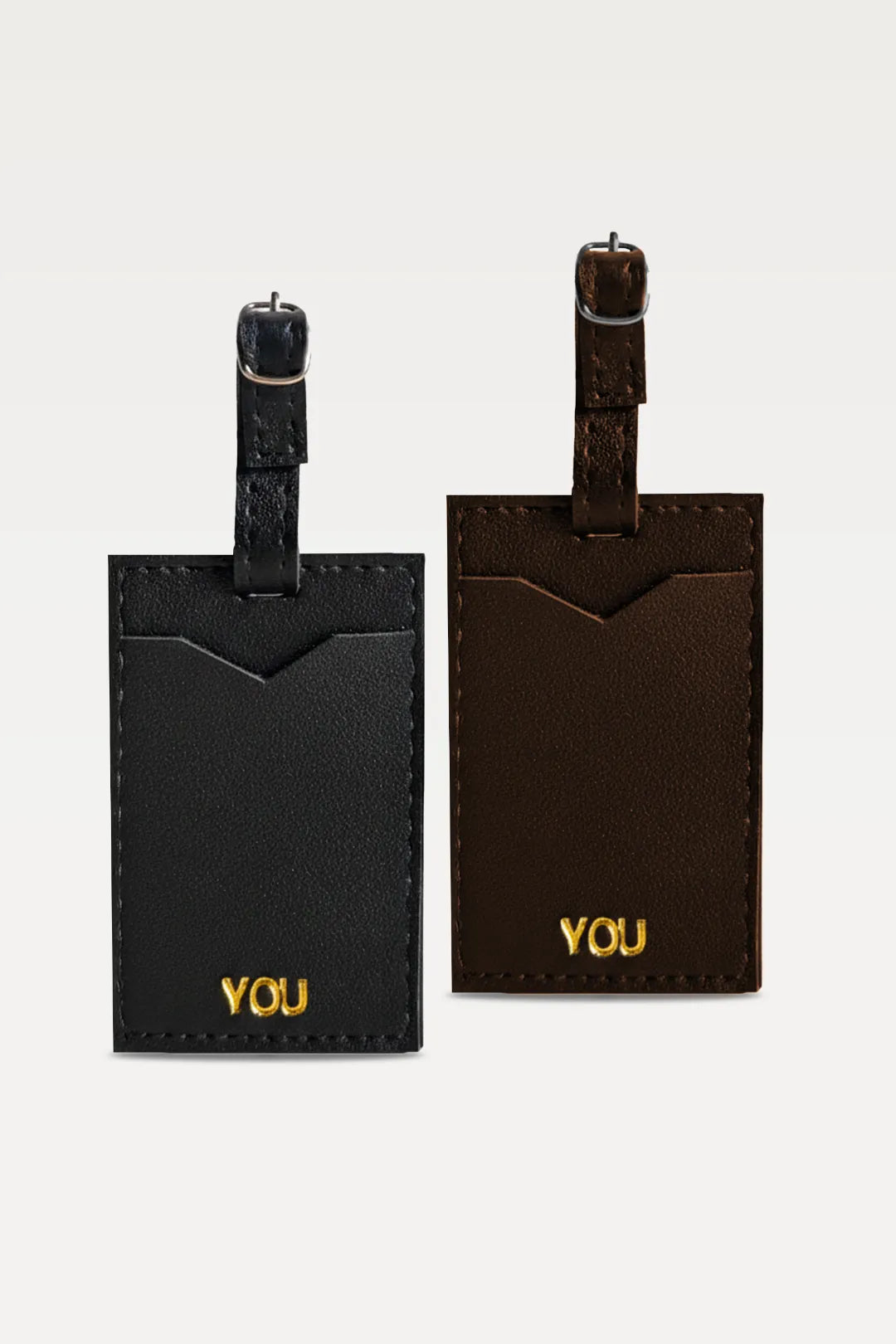 Two black luggage tags with 'YOU' text on a white background
#global