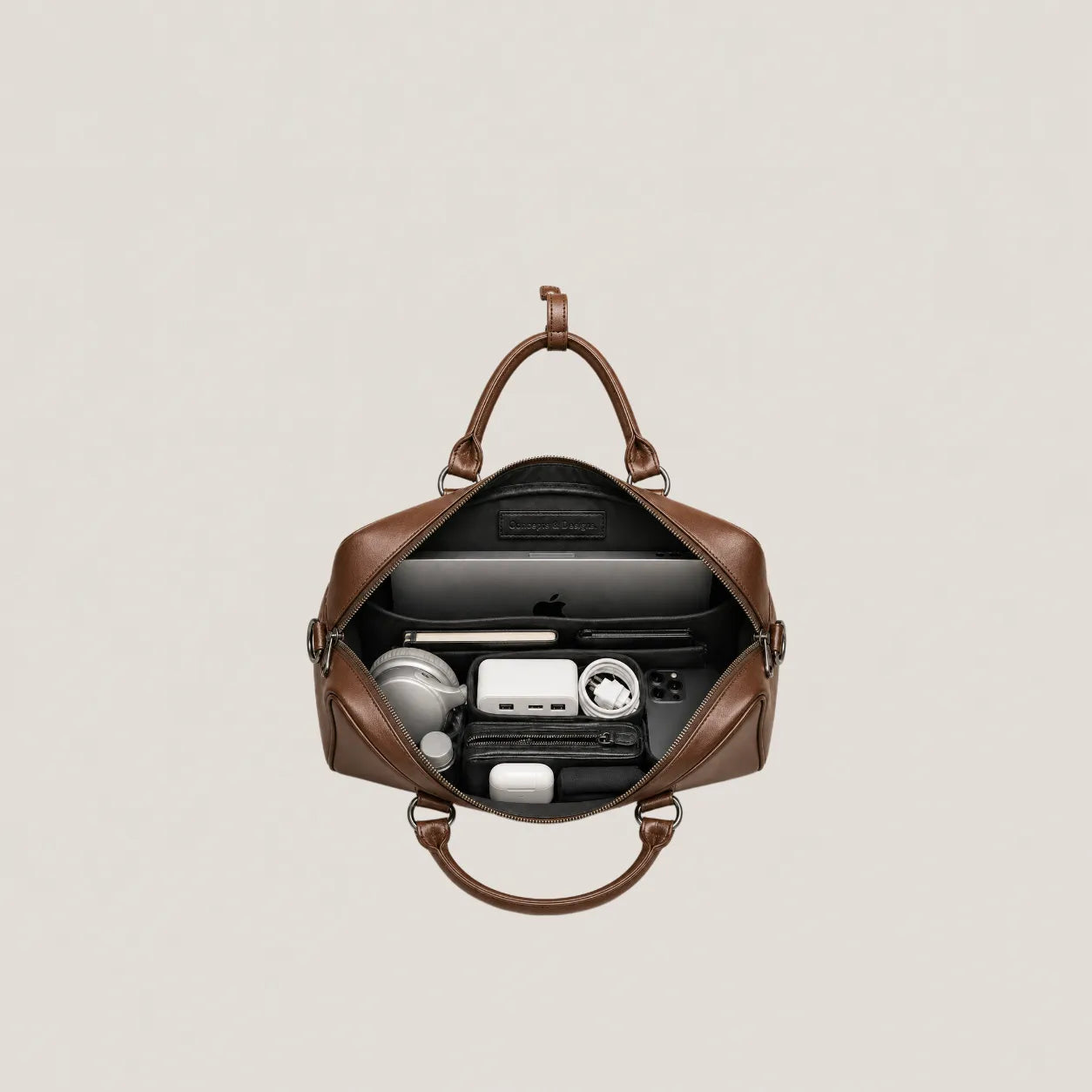 Laptop bag showing its content
#color_brown