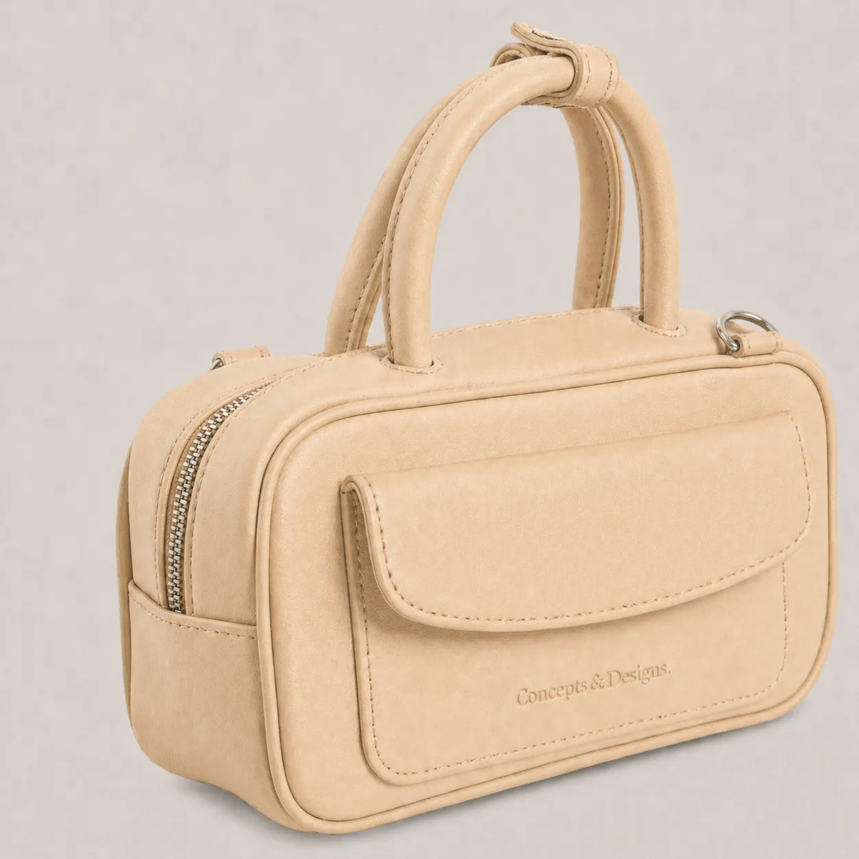 Beige elongated mini bag close up
#color_light beige