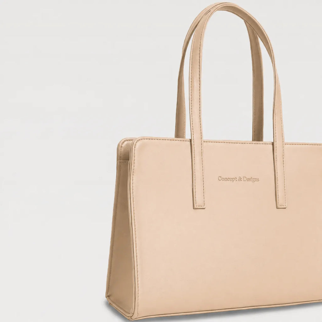 Beige handbag with 'Concept & Design' branding on a light gray background
#color_light beige