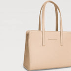 Beige handbag with 'Concept & Design' branding on a light gray background
#color_light beige