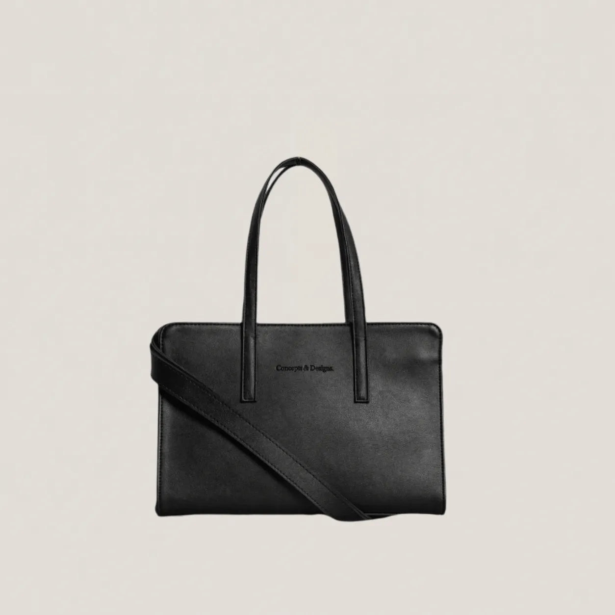 Black handbag with a shoulder strap on a light beige background
#color_midnight