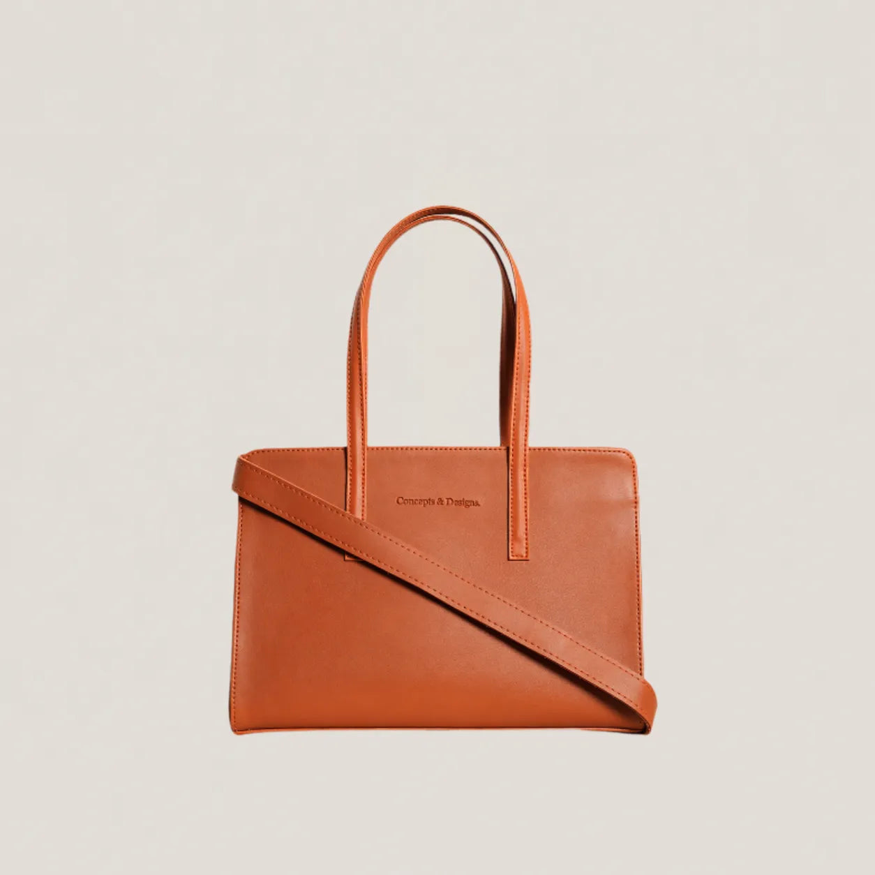 Brown leather handbag with a shoulder strap on a light beige background
#color_tan