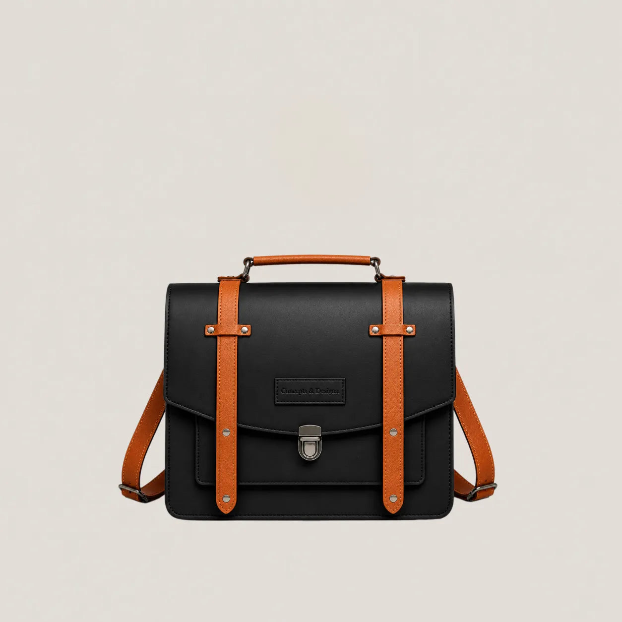 Black leather satchel with brown straps on a light beige background
#color_fusion