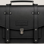 Black leather briefcase with straps and a visible brand logo on a light gray background
#color_midnight
