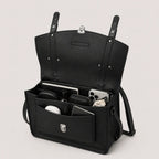 Black leather bag with compartments on a light gray background
#color_midnight