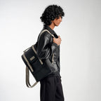 Man carrying a black and gray backpack on a white background
#color_charcoal
