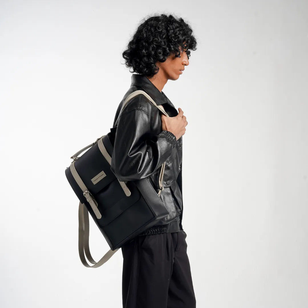 Man carrying a black and gray backpack on a white background
#color_charcoal
