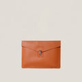 Orange leather clutch bag with a silver clasp on a beige background
#color_chestnut