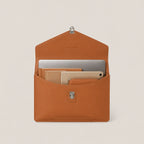 Brown leather sleeve with compartments for electronic devices on a beige background
#color_chestnut