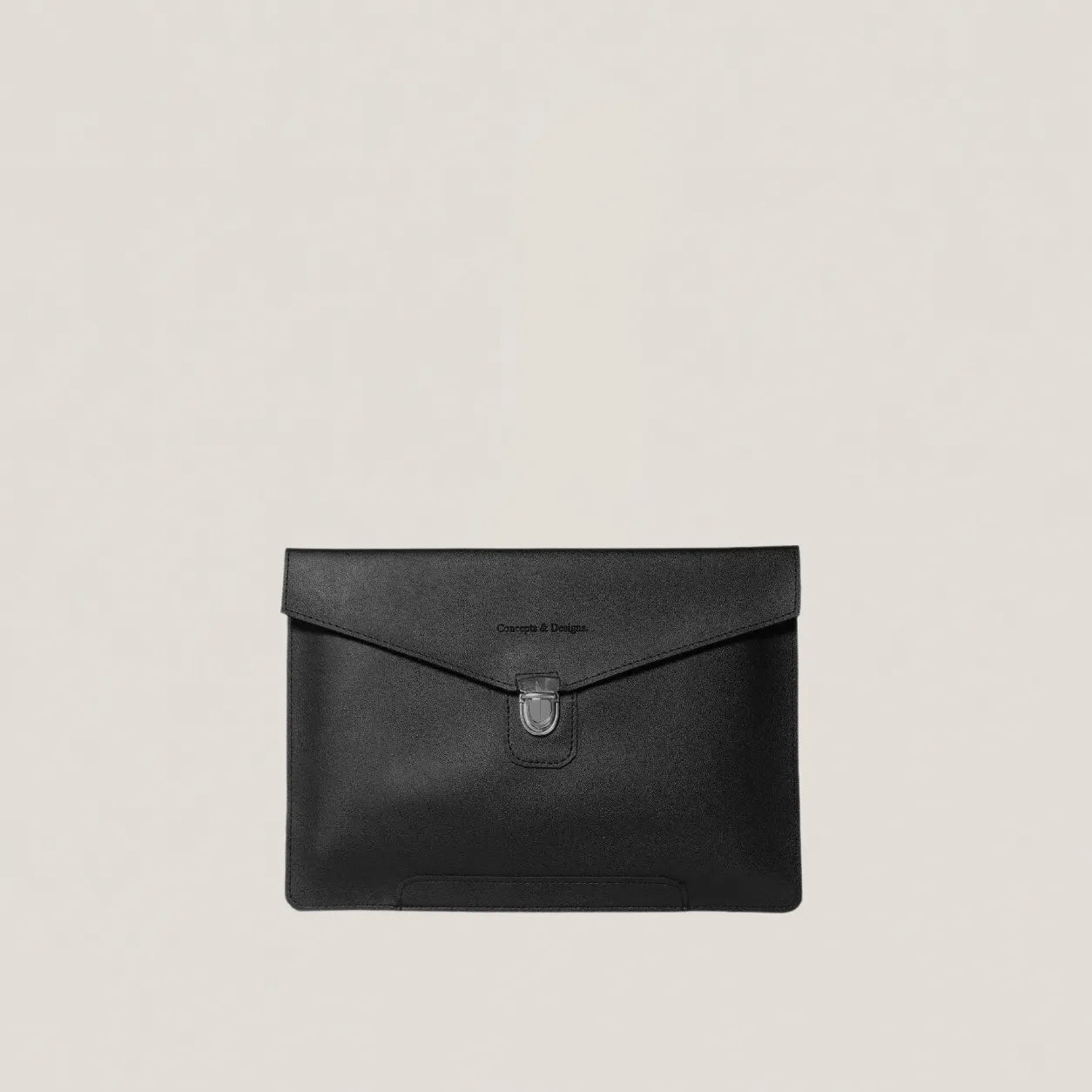 Black leather clutch bag on a beige background
#color_midnight