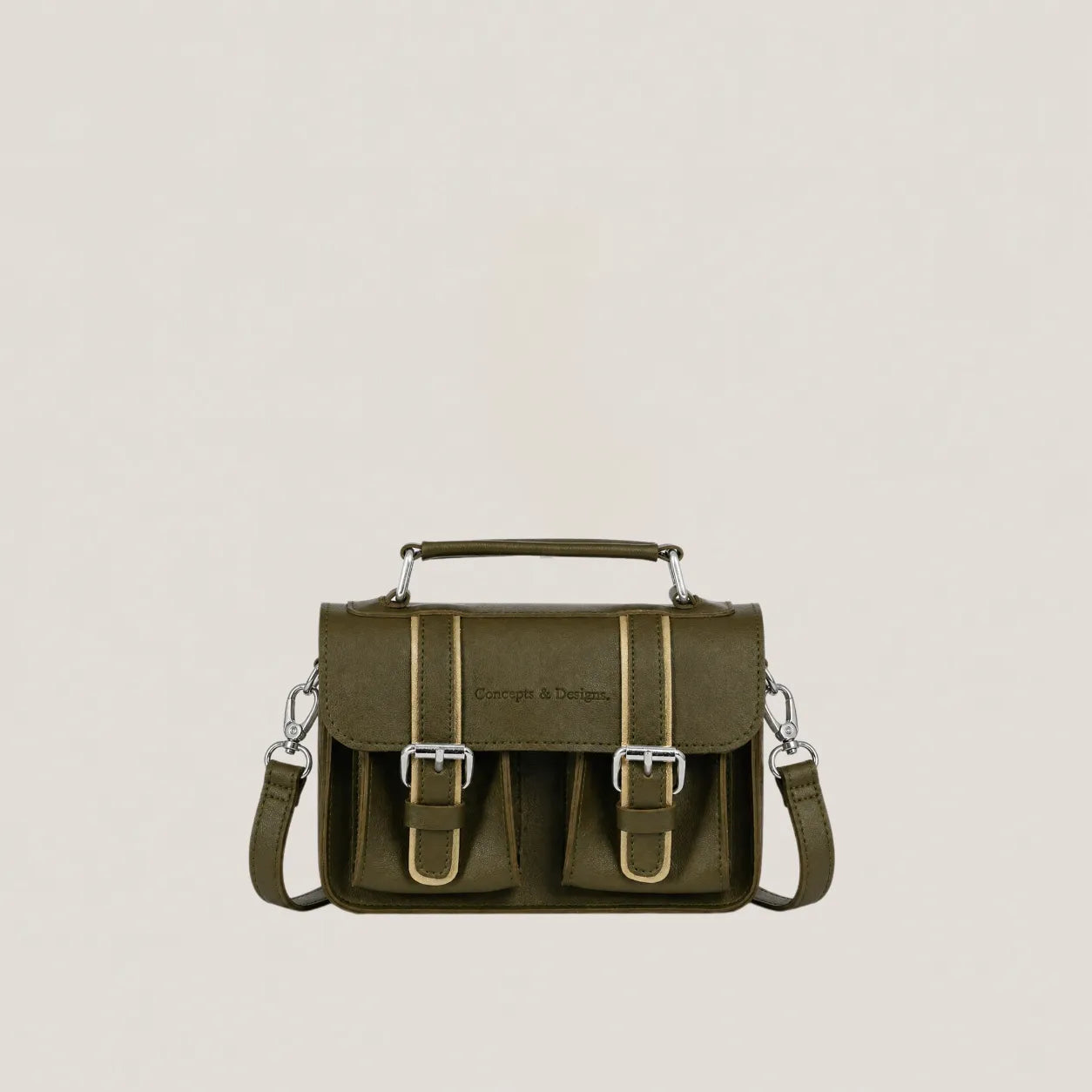 Green leather satchel bag with metal buckles on a beige background
#color_fern