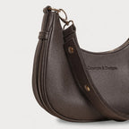 A close up of a brown crescent-shaped bag
#color_brown