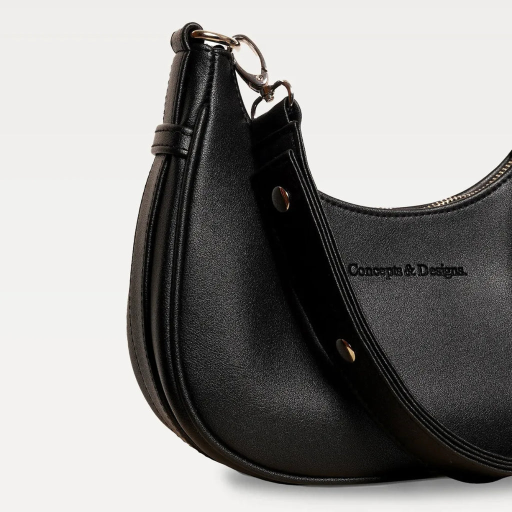 A close up of a black crescent-shaped bag
#color_midnight