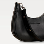 A close up of a black crescent-shaped bag
#color_midnight