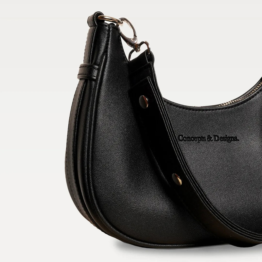A close up of a black crescent-shaped bag
#color_midnight