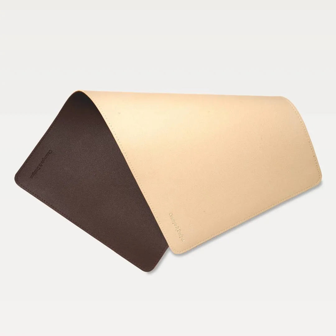 Leather mouse pad with two colors, one brown and one beige, on a light gray background.
#color_beige & dark brown