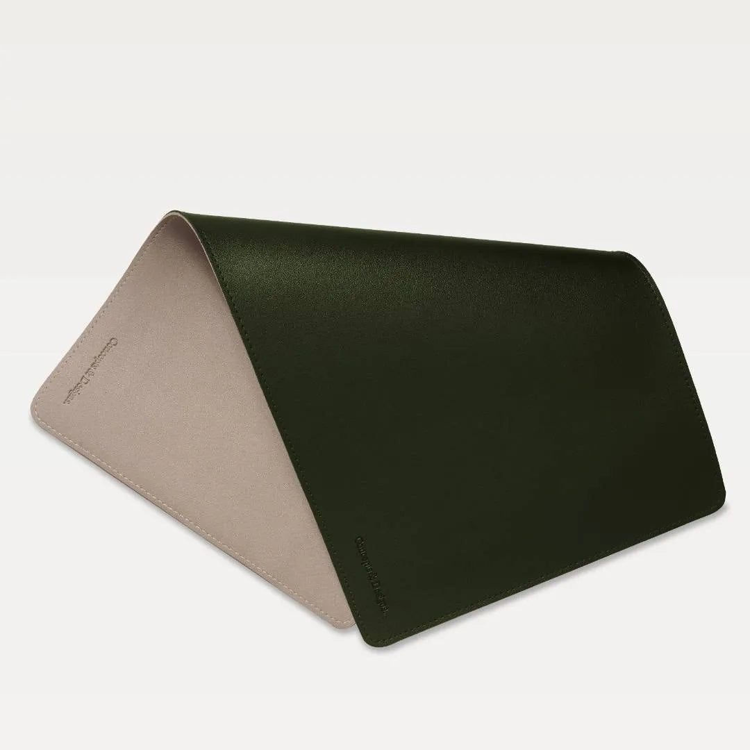 Leather mouse pad with two colors, one olive and one bone, on a light gray background.
#color_olive & bone